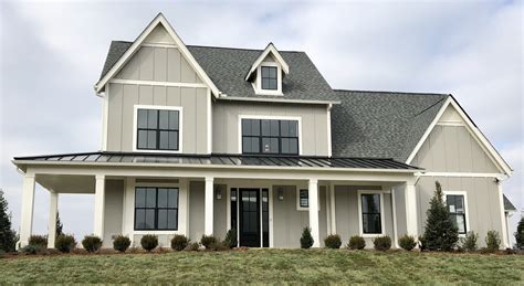 beige house with gray metal roofing|beige exterior homes with gray roof.